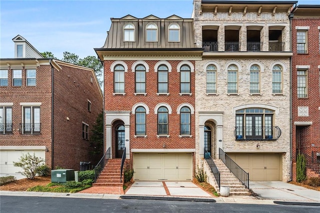 townhome / multi-family property featuring a garage and central air condition unit