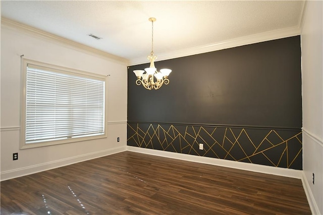 unfurnished room with crown molding, a chandelier, and dark hardwood / wood-style floors