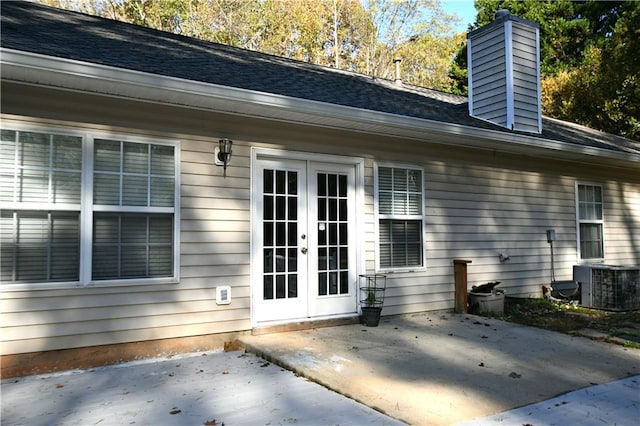 exterior space with french doors, central AC, and a patio area