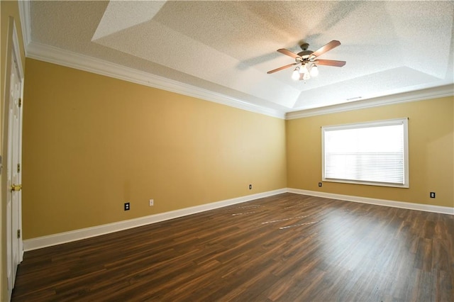 unfurnished room featuring ceiling fan, a raised ceiling, dark hardwood / wood-style floors, crown molding, and a textured ceiling