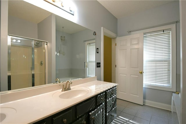 bathroom featuring vanity, tile patterned floors, and an enclosed shower