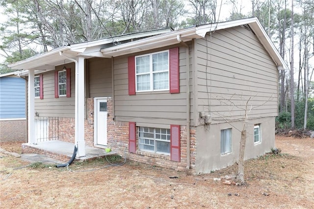 bi-level home with brick siding