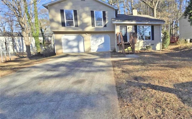 split level home featuring a garage