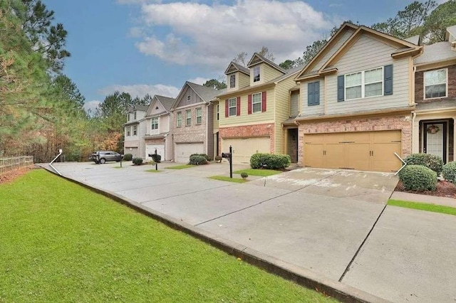 2626 Sardis Chase Ct, Buford, GA 30519 - view of front facade featuring driveway, a garage, a residential view, brick siding, and a front lawn