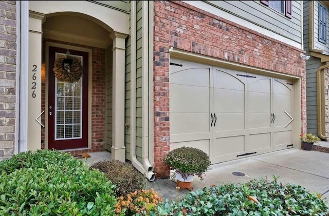 2626 Sardis Chase Ct, Buford, GA 30519 - entrance to property featuring brick siding, a garage, and driveway