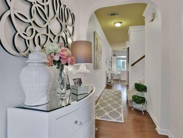 2626 Sardis Chase Ct, Buford, GA 30519 - hall with arched walkways, crown molding, wood finished floors, and stairway
