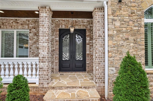 doorway to property featuring covered porch