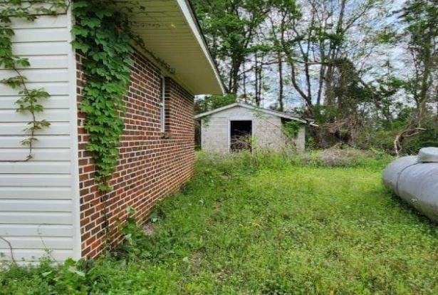 1705 Clifton St, Camden, AL 36726 - view of yard featuring an outbuilding