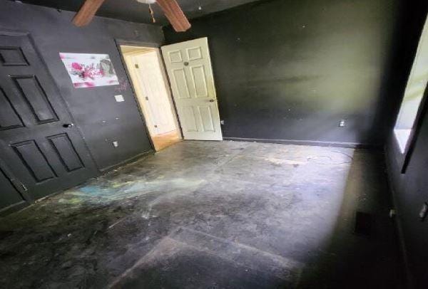 1705 Clifton St, Camden, AL 36726 - unfurnished bedroom with concrete flooring and beamed ceiling