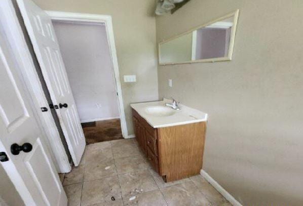 1705 Clifton St, Camden, AL 36726 - bathroom featuring vanity, baseboards, and tile patterned floors