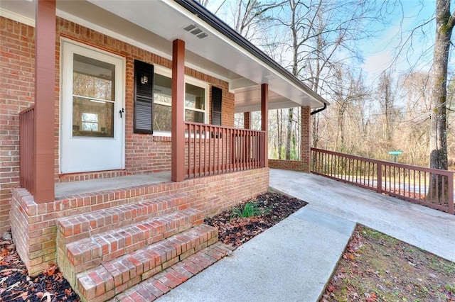 view of side of home featuring a porch