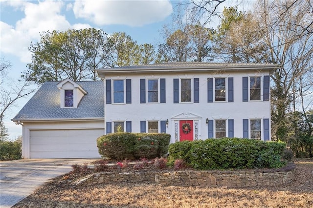 colonial home featuring a garage