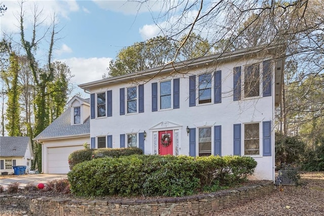 colonial-style house featuring a garage