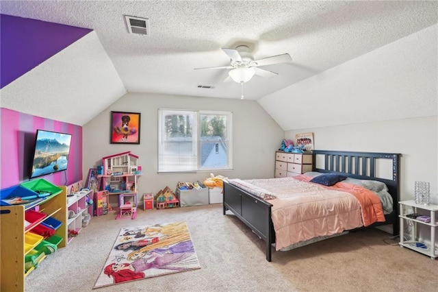 carpeted bedroom with ceiling fan, lofted ceiling, and a textured ceiling