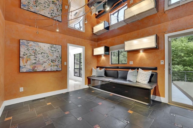 2683 Tritt Springs Trce NE, Marietta, GA 30062 - living area featuring baseboards and a towering ceiling