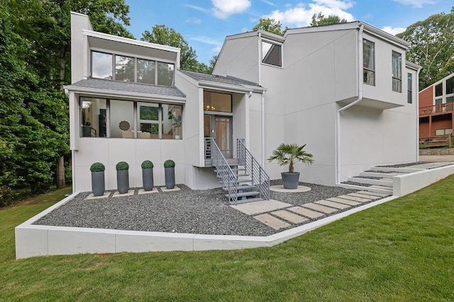2683 Tritt Springs Trce NE, Marietta, GA 30062 - contemporary house with a front yard, a chimney, and stucco siding