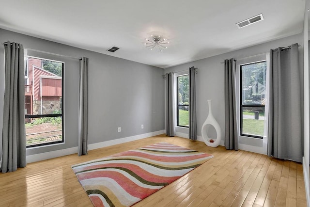 2683 Tritt Springs Trce NE, Marietta, GA 30062 - empty room with healthy amount of natural light and light wood-style flooring