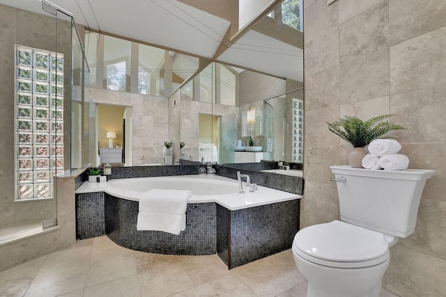 2683 Tritt Springs Trce NE, Marietta, GA 30062 - full bathroom with tile walls, a garden tub, a tile shower, and tile patterned flooring