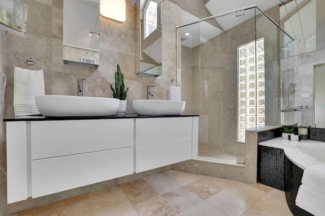 2683 Tritt Springs Trce NE, Marietta, GA 30062 - bathroom featuring a shower stall, tile walls, double vanity, and a tub to relax in