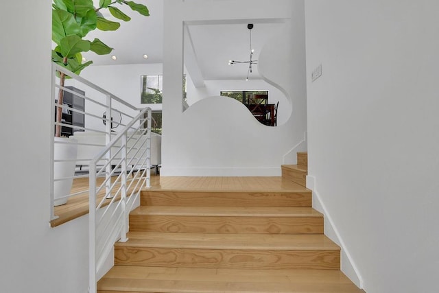 2683 Tritt Springs Trce NE, Marietta, GA 30062 - stairs with high vaulted ceiling and a chandelier