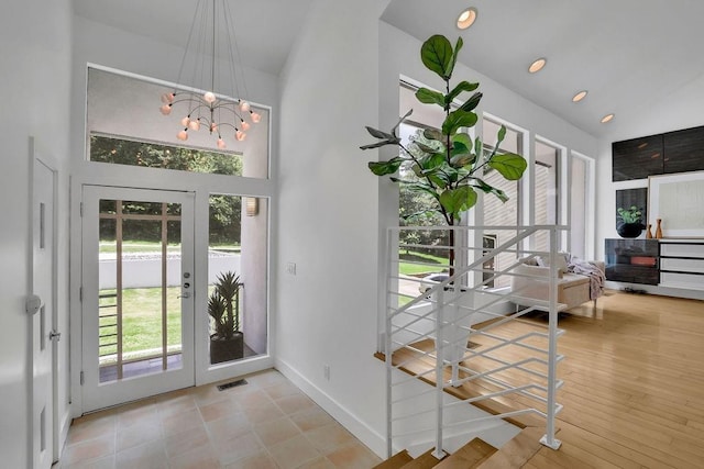2683 Tritt Springs Trce NE, Marietta, GA 30062 - entryway with high vaulted ceiling, a chandelier, and french doors