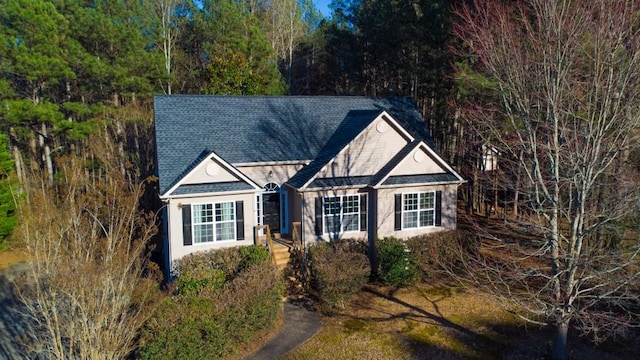 view of front of home featuring a shingled roof