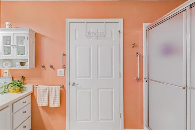 full bath featuring a shower stall and vanity