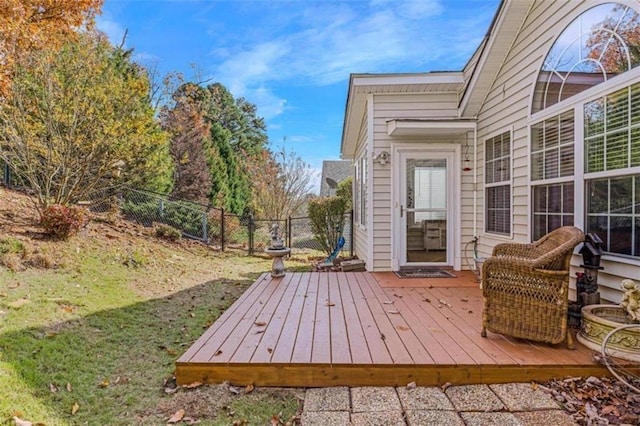 wooden terrace featuring fence