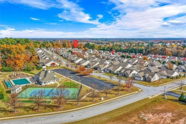 birds eye view of property with a residential view