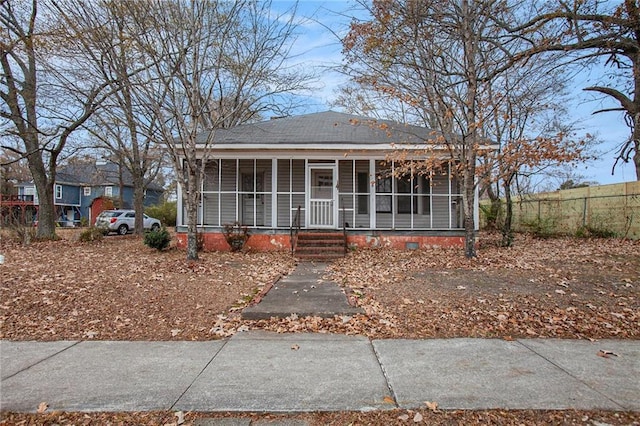 view of front facade with a sunroom