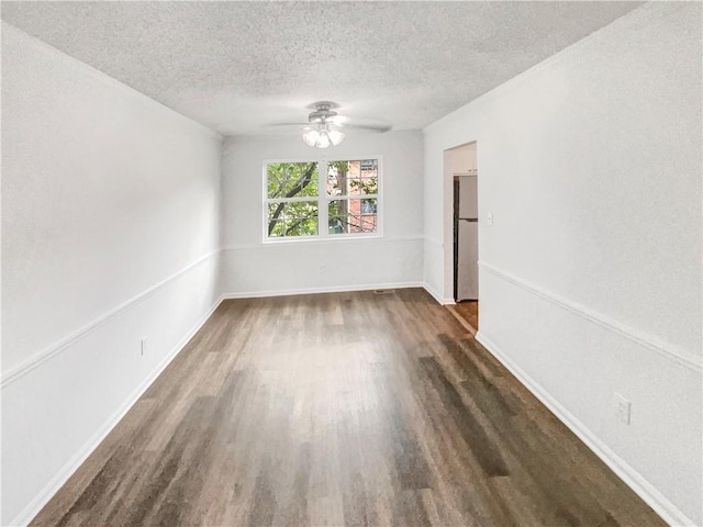6354 Shannon Pkwy Unit 8B, Union City, GA 30291 - empty room with dark wood finished floors, ceiling fan, and a textured ceiling