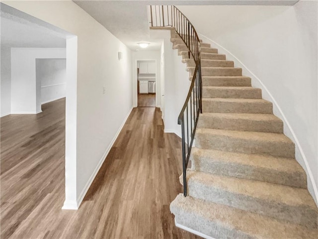 6354 Shannon Pkwy Unit 8B, Union City, GA 30291 - stairs featuring wood finished floors and baseboards