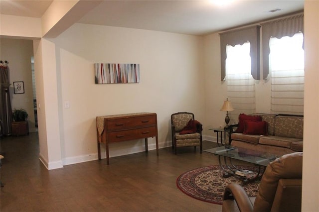 living room with dark hardwood / wood-style flooring