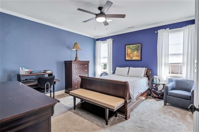 bedroom featuring light carpet, visible vents, a ceiling fan, and crown molding