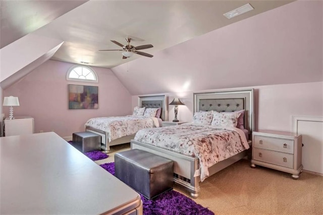 bedroom with carpet floors, visible vents, vaulted ceiling, and ceiling fan