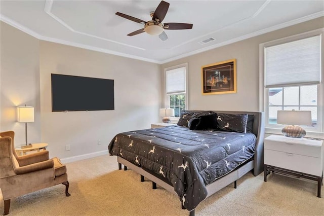 bedroom with ceiling fan, visible vents, baseboards, ornamental molding, and carpet