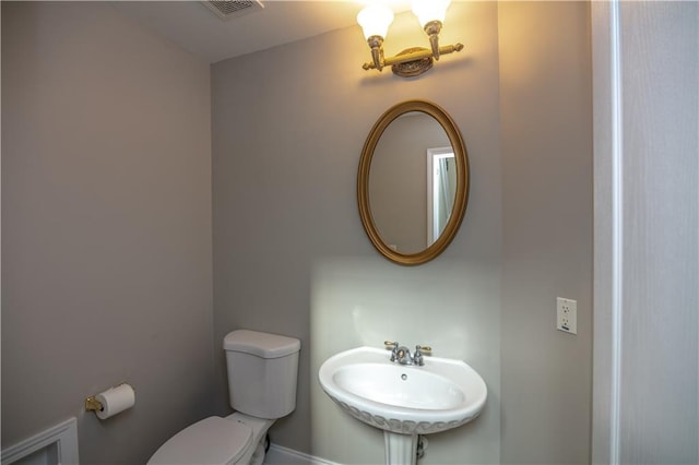 bathroom featuring sink and toilet