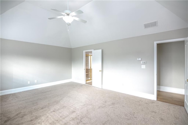 unfurnished bedroom with lofted ceiling, carpet, ceiling fan, and ensuite bathroom