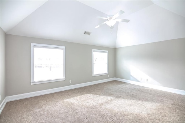 empty room with carpet floors, lofted ceiling, and ceiling fan