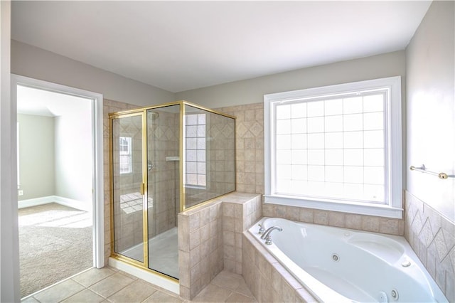 bathroom featuring plus walk in shower and tile patterned flooring