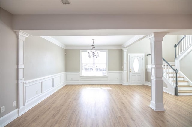 interior space featuring a chandelier, light hardwood / wood-style flooring, and ornamental molding