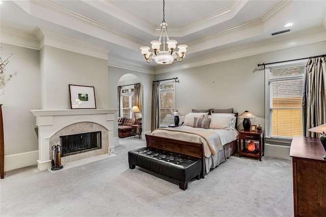 1109 Pine Grove Ave NE, Brookhaven, GA 30319 - carpeted bedroom featuring a chandelier, ornamental molding, arched walkways, a premium fireplace, and a tray ceiling