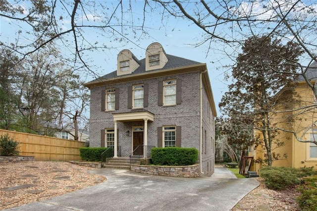 1109 Pine Grove Ave NE, Brookhaven, GA 30319 - colonial-style house featuring brick siding and fence