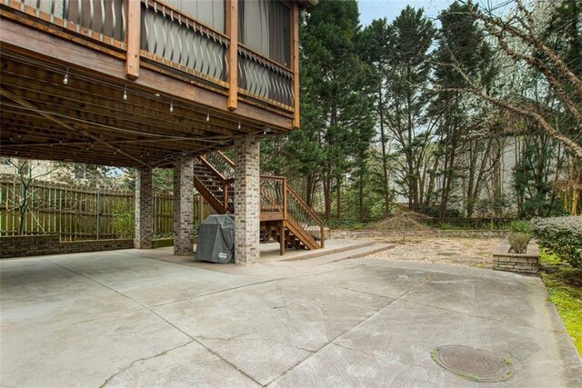 1109 Pine Grove Ave NE, Brookhaven, GA 30319 - view of patio with stairway and fence