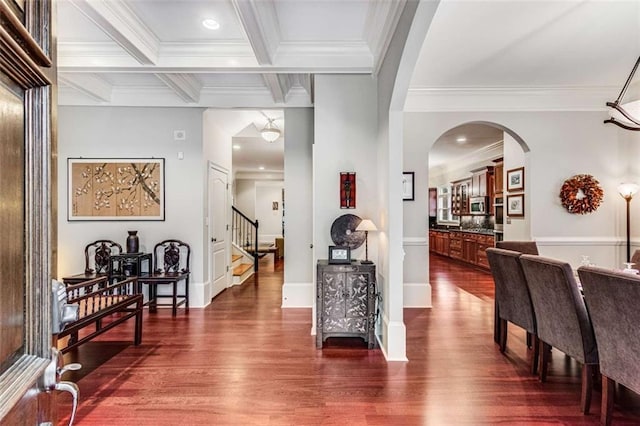 1109 Pine Grove Ave NE, Brookhaven, GA 30319 - hall with dark wood-style flooring, ornamental molding, stairway, beam ceiling, and arched walkways