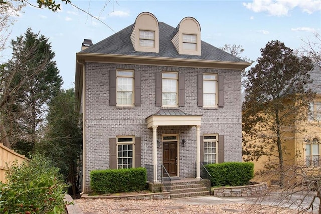 1109 Pine Grove Ave NE, Brookhaven, GA 30319 - view of front of home featuring brick siding, a chimney, and a shingled roof