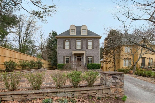 1109 Pine Grove Ave NE, Brookhaven, GA 30319 - colonial-style house with fence and brick siding