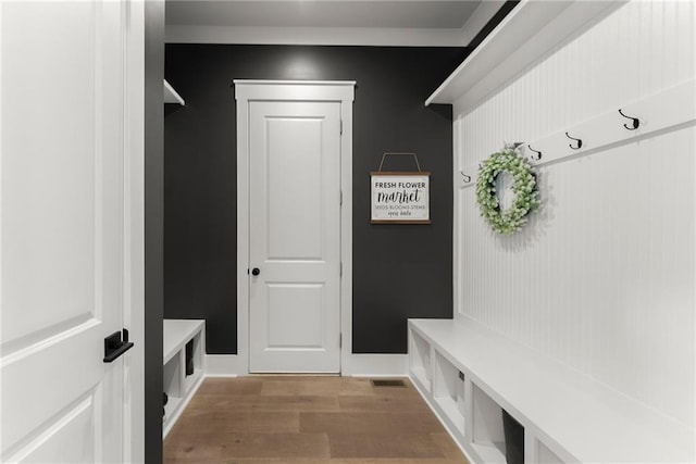 mudroom with light wood-style flooring and baseboards