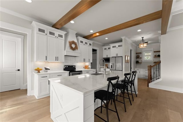 kitchen with backsplash, a sink, beam ceiling, appliances with stainless steel finishes, and custom exhaust hood