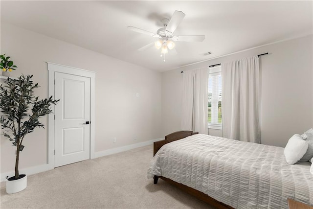 bedroom featuring ceiling fan, baseboards, carpet flooring, and visible vents
